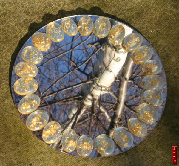 Aspect Set on a round mirror under a birch tree
